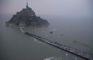 tide of the century,  (mont saint-michel, 11th century abbey,  france's normandy coast)